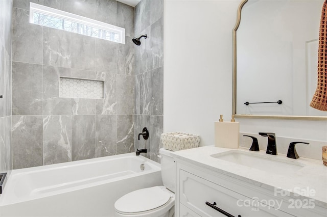 bathroom with toilet, shower / washtub combination, and vanity