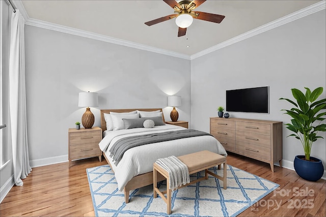 bedroom with light wood finished floors, a ceiling fan, crown molding, and baseboards