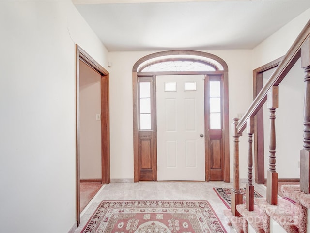 entryway featuring a healthy amount of sunlight and stairs