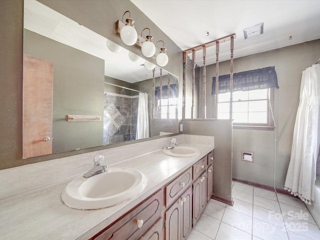 full bathroom with curtained shower, visible vents, a sink, and tile patterned floors