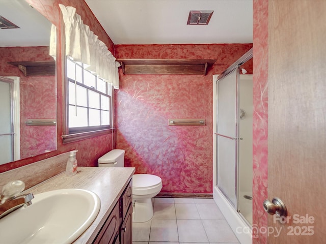 full bath featuring tile patterned flooring, visible vents, a shower stall, and wallpapered walls