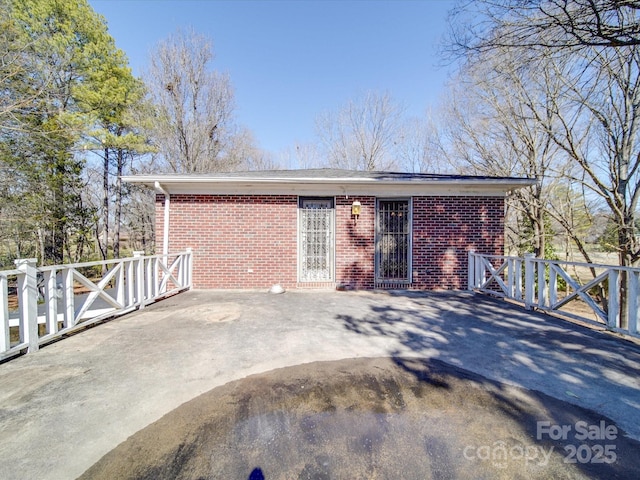 exterior space with brick siding