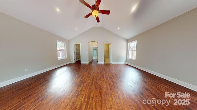 interior space featuring dark wood-type flooring, a wealth of natural light, and ceiling fan