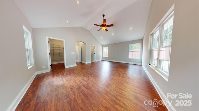 unfurnished living room with vaulted ceiling, ceiling fan, and dark hardwood / wood-style flooring