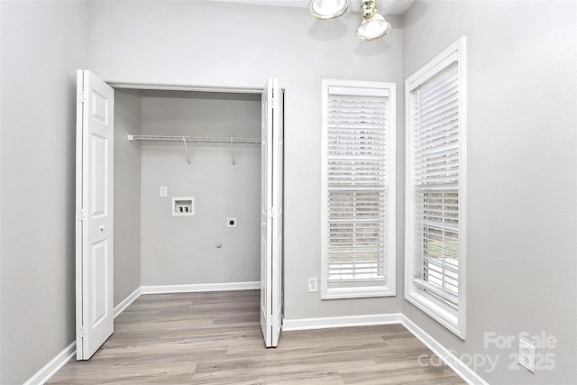 clothes washing area featuring hookup for a washing machine, laundry area, hookup for an electric dryer, and wood finished floors