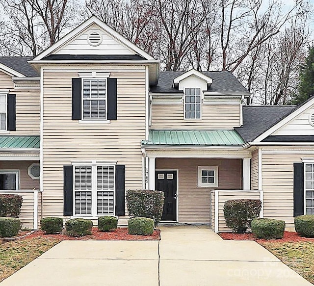 view of front of home with metal roof and a porch