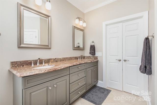 bathroom featuring tile patterned floors, crown molding, and vanity