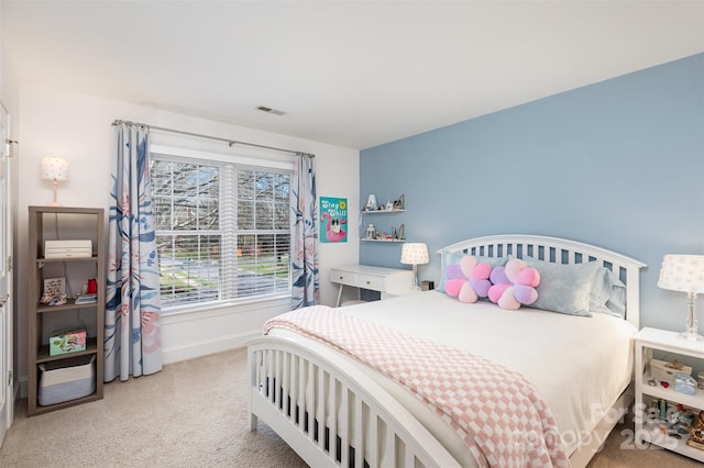 bedroom with light carpet