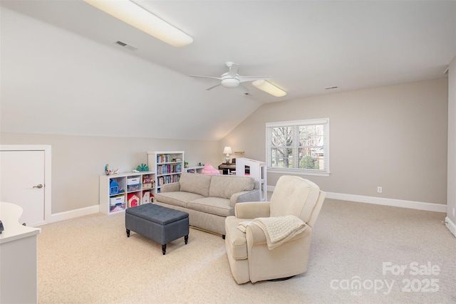 living room with lofted ceiling, light colored carpet, and ceiling fan