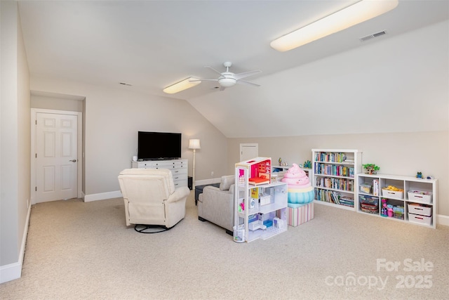 rec room featuring lofted ceiling, light colored carpet, and ceiling fan