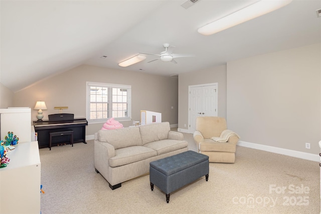 living room featuring vaulted ceiling, light colored carpet, and ceiling fan