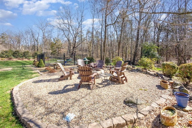 view of yard with an outdoor fire pit