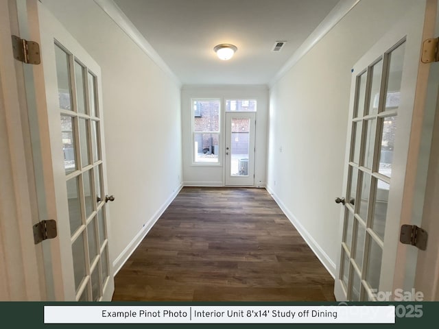 doorway with french doors, visible vents, ornamental molding, and dark wood finished floors