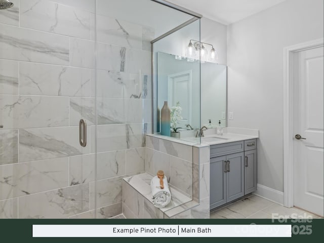 bathroom featuring baseboards, vanity, marble finish floor, and a shower stall