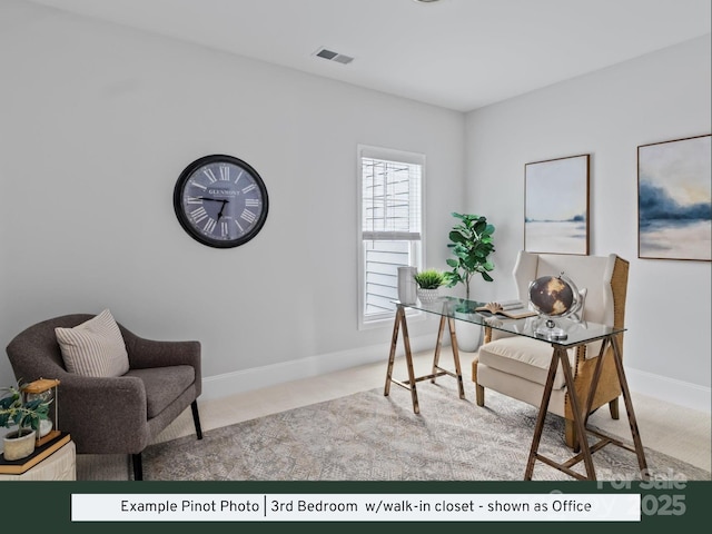 office area featuring visible vents, baseboards, and carpet floors