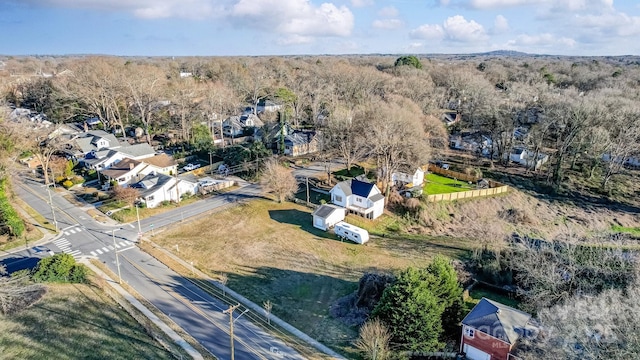 aerial view featuring a wooded view