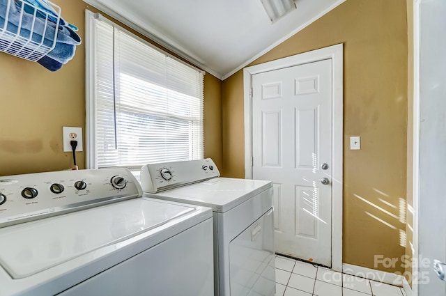 laundry area featuring laundry area, washer and clothes dryer, and light tile patterned flooring