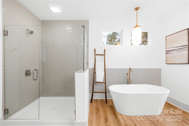 5147 Star Magnolia Ct, Clover, SC 29710 - full bathroom with a shower stall, a freestanding bath, and wood finished floors