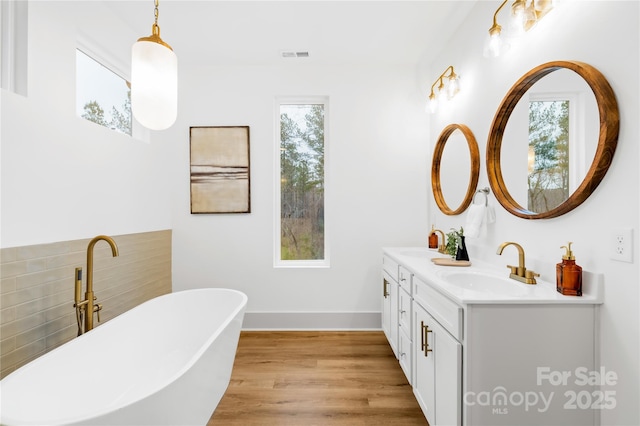 5147 Star Magnolia Ct, Clover, SC 29710 - full bathroom featuring visible vents, a sink, double vanity, and wood finished floors