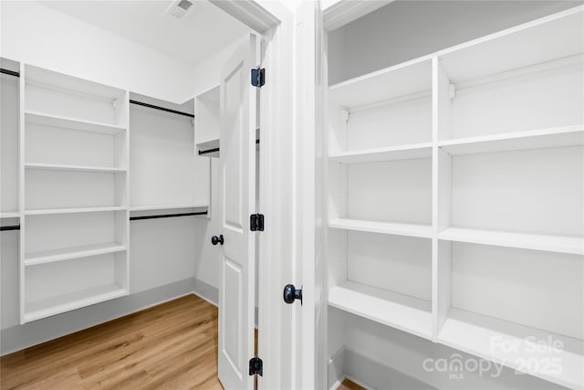 5147 Star Magnolia Ct, Clover, SC 29710 - walk in closet featuring visible vents and light wood-style flooring