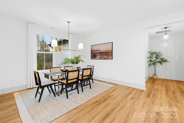 5147 Star Magnolia Ct, Clover, SC 29710 - dining area with baseboards, light wood finished floors, and visible vents