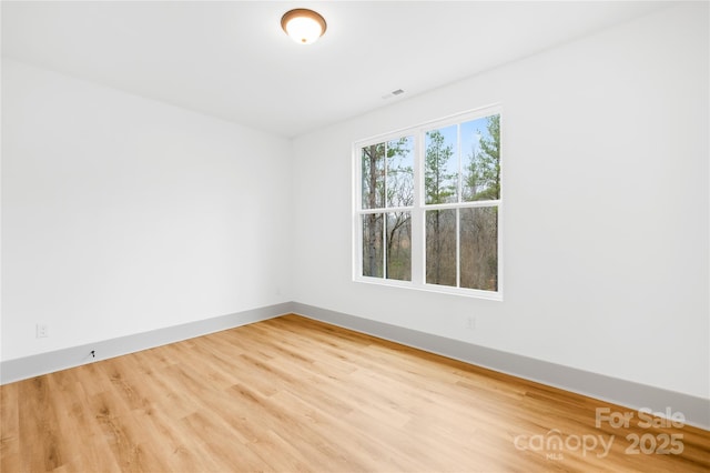 5147 Star Magnolia Ct, Clover, SC 29710 - unfurnished room with baseboards, visible vents, and wood finished floors