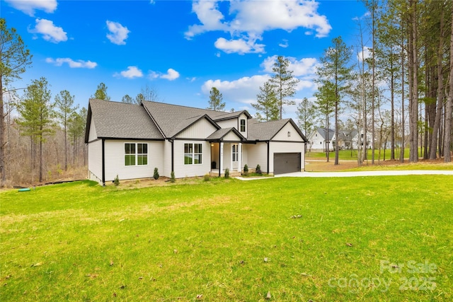 5147 Star Magnolia Ct, Clover, SC 29710 - modern inspired farmhouse featuring concrete driveway, a front lawn, roof with shingles, and an attached garage