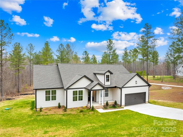 5147 Star Magnolia Ct, Clover, SC 29710 - modern inspired farmhouse with a shingled roof, driveway, a front yard, and a garage