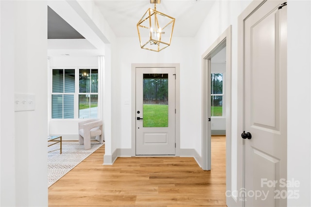 5147 Star Magnolia Ct, Clover, SC 29710 - entrance foyer featuring a wealth of natural light, light wood-style floors, baseboards, and an inviting chandelier