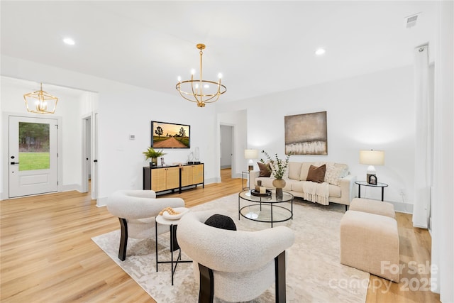 5147 Star Magnolia Ct, Clover, SC 29710 - living room with light wood finished floors, visible vents, recessed lighting, and an inviting chandelier