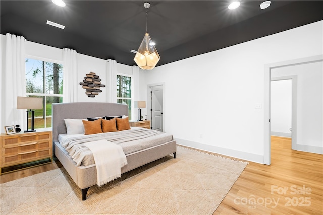 5147 Star Magnolia Ct, Clover, SC 29710 - bedroom with baseboards, wood finished floors, and recessed lighting