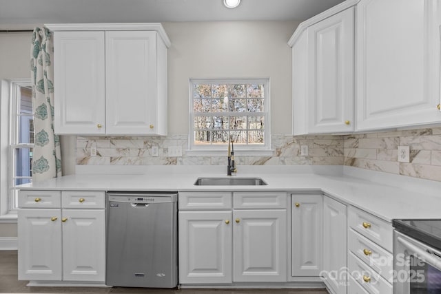 kitchen with sink, appliances with stainless steel finishes, and white cabinets