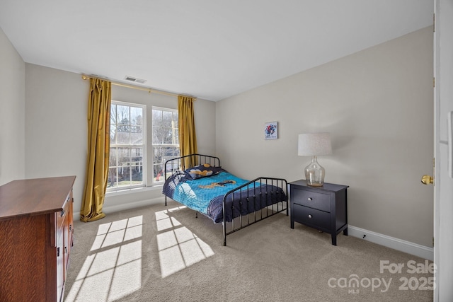 bedroom featuring light colored carpet