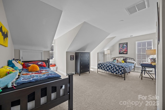 carpeted bedroom featuring vaulted ceiling