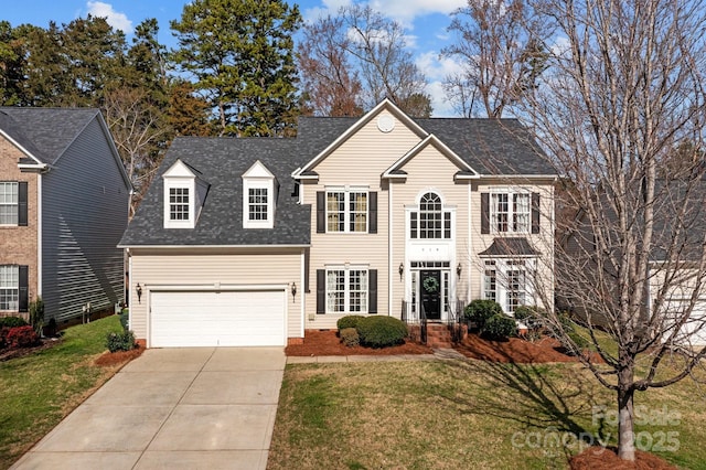 view of front facade with a front lawn and a garage