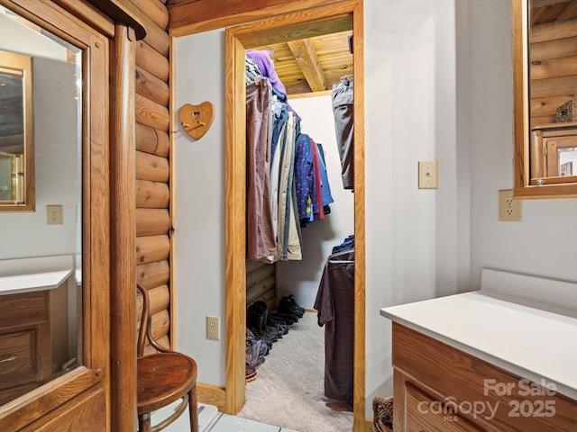 spacious closet with carpet floors