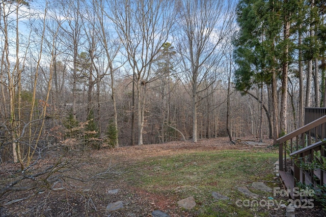 view of yard with a wooded view