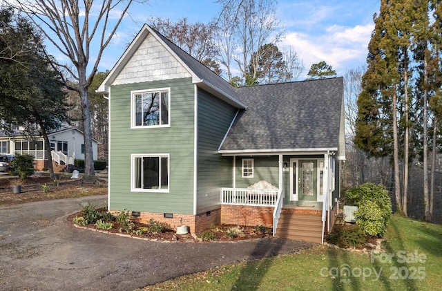 view of front of house featuring a porch, aphalt driveway, a shingled roof, and crawl space