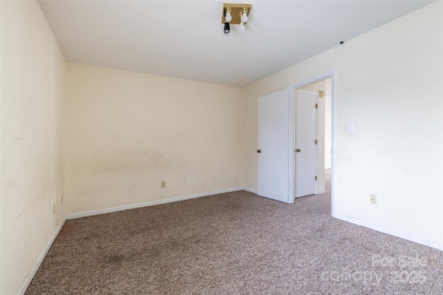 unfurnished room featuring carpet flooring