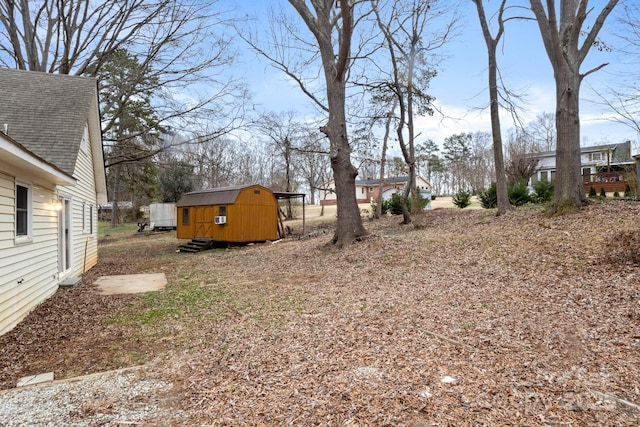 view of yard with a storage unit