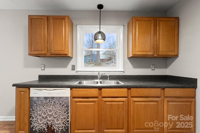 kitchen featuring sink, pendant lighting, and dishwasher