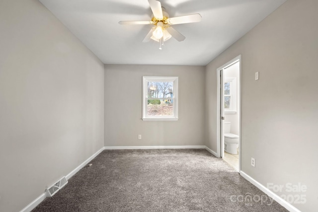 carpeted empty room with ceiling fan