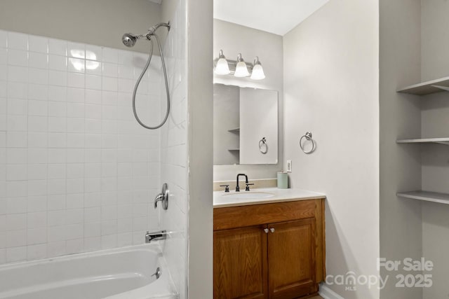 bathroom featuring vanity and tiled shower / bath combo