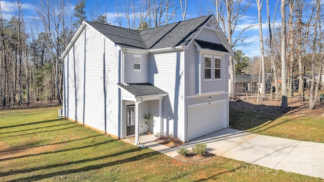 view of home's exterior with a garage, driveway, a lawn, and roof with shingles