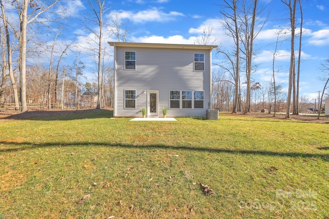 view of front of house featuring central AC unit and a front lawn