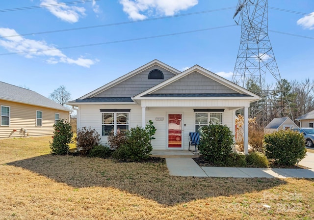 view of front of home featuring a porch and a front lawn