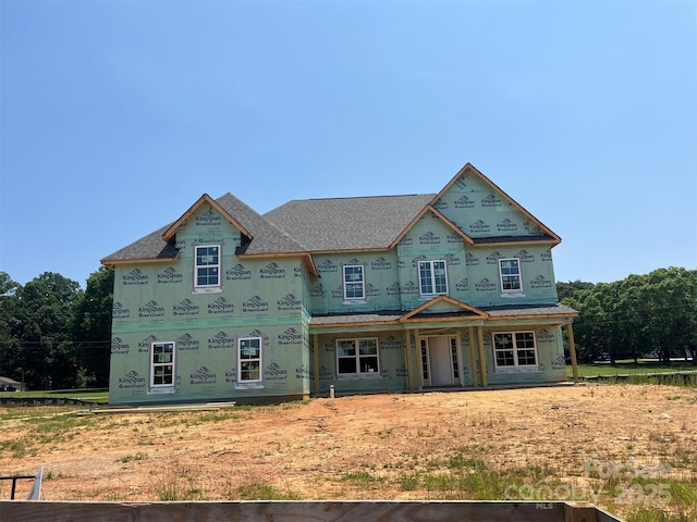 11016 Tyler Brook Ln Unit Oak0036, Mint Hill, NC 28227 - unfinished property with stucco siding, a porch, and roof with shingles