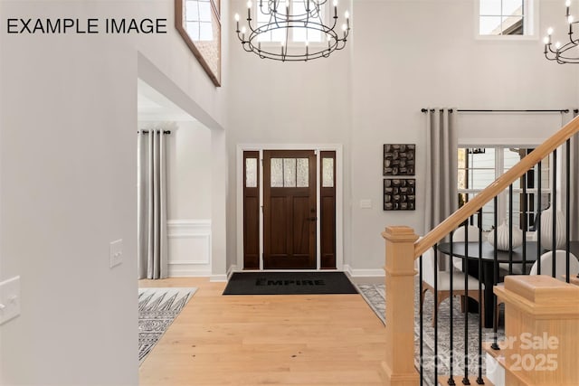 11016 Tyler Brook Ln Unit Oak0036, Mint Hill, NC 28227 - entryway with a chandelier, wood finished floors, stairs, and a high ceiling