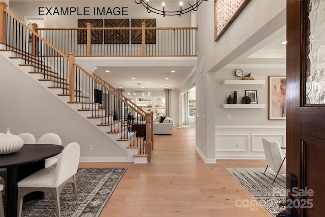 11016 Tyler Brook Ln Unit Oak0036, Mint Hill, NC 28227 - foyer entrance with stairway, light wood-type flooring, a chandelier, ornamental molding, and a high ceiling