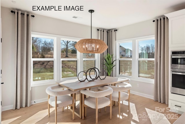 11016 Tyler Brook Ln Unit Oak0036, Mint Hill, NC 28227 - dining area with light wood finished floors and plenty of natural light